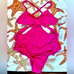 Cute, hot pink, cut out strappy one piece. XL but cut is smaller